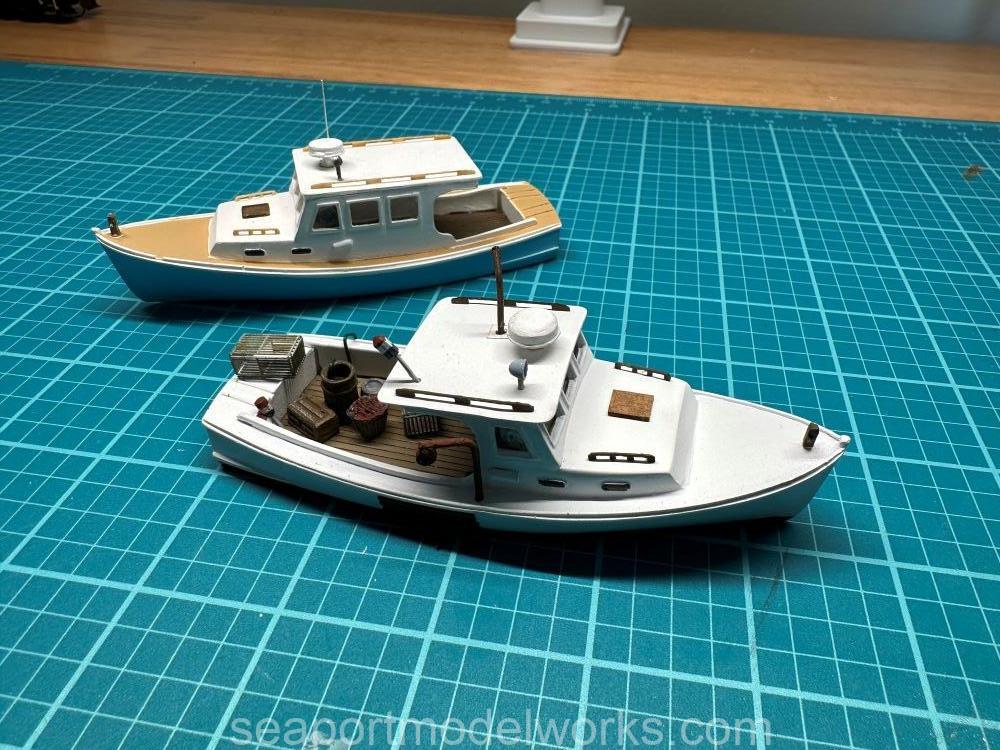  H128-5 HO Cruiser (in background) and the H128-1 HO lobster boat