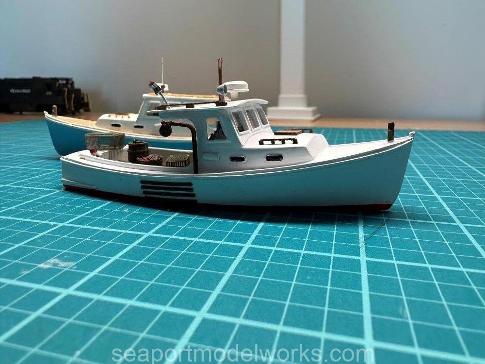  H128-5 HO Cruiser and the H128-1 HO lobster boat