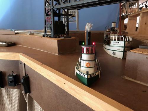  Michael Rinehart builds the H116 HO Tug (foreground) and the HO-1125 Sylvan 81' White Swan Motor Vessel (background)