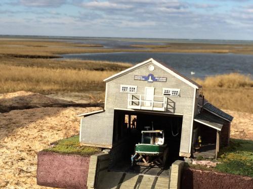 Tidewater Wharfs Boat builder Front of Building at Paines Creek with H128 HO Lobster boat in the shop